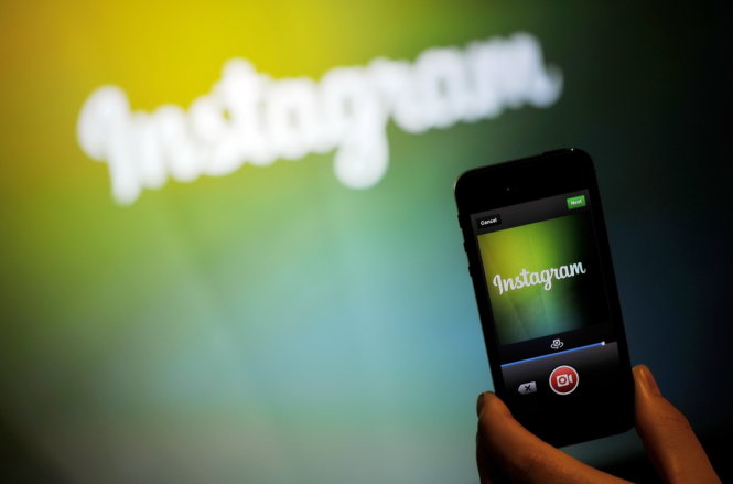 (FILES) This June 20, 2013 file photo shows an Instagram employee as they display Instagram's video function at Facebook's corporate headquarters during a media event in Menlo Park, California. Instagram on on August 27, 2015 broke its square mold with an update that adds portrait and landscape formats to the image-sharing smartphone application."Square format has been and always will be part of who we are," Instagram said in a blog post. "That said, the visual story you're trying to tell should always come first, and we want to make it simple and fun for you to share moments just the way you want to." Updated versions of Instagram tailored for mobile devices powered by Apple or Android software let users share photos or videos in portrait or landscape styles. AFP Photo /Josh EDELSON